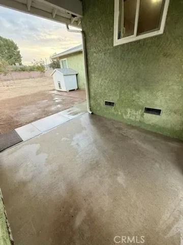 a backyard of a house with yard fire pit and outdoor seating