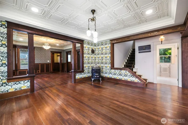 a view of entryway with wooden floor and chandelier