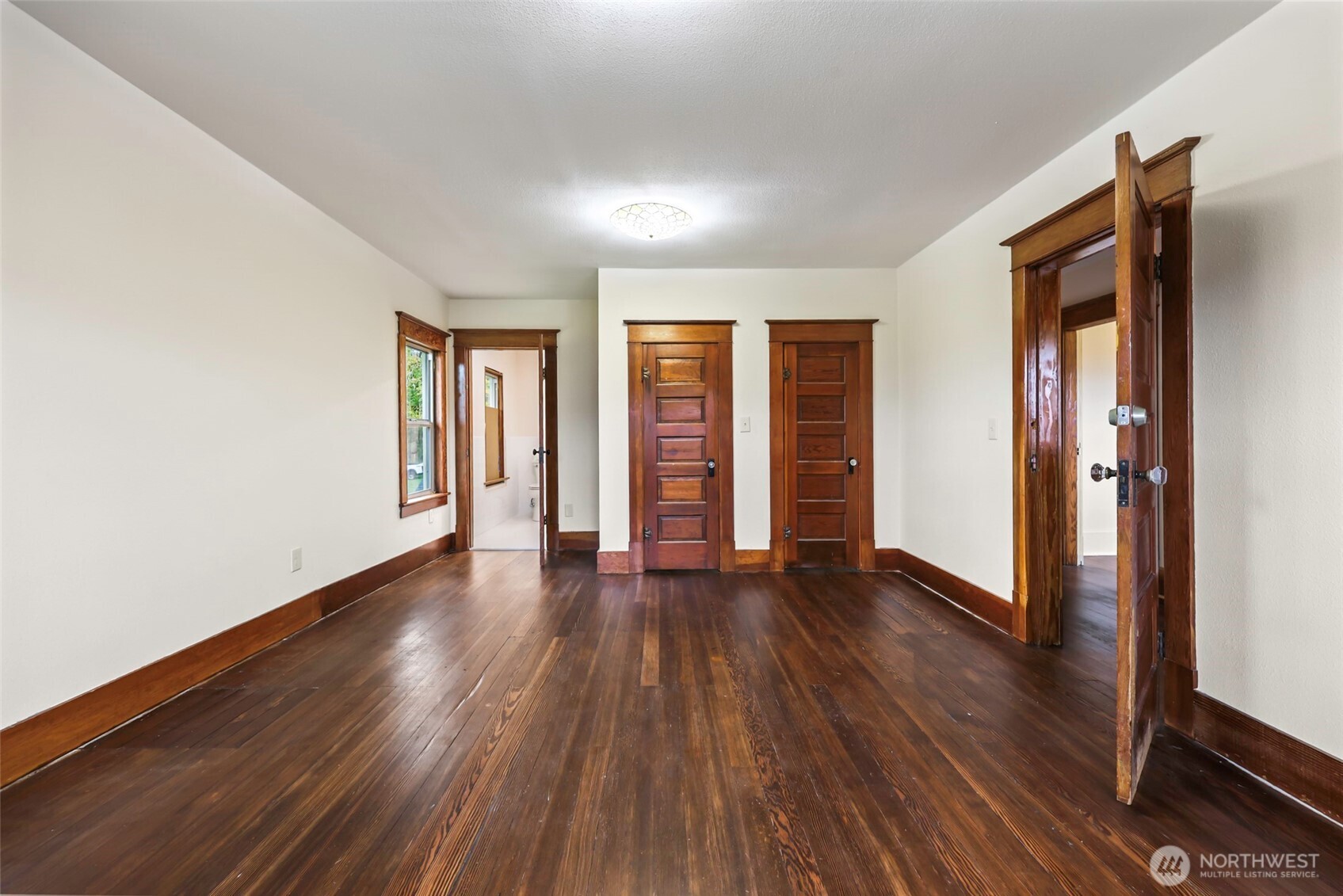 1604 Lincoln Creek Road Rochester, WA 98579 - Photo 24 of 37 an empty room with wooden floor and windows