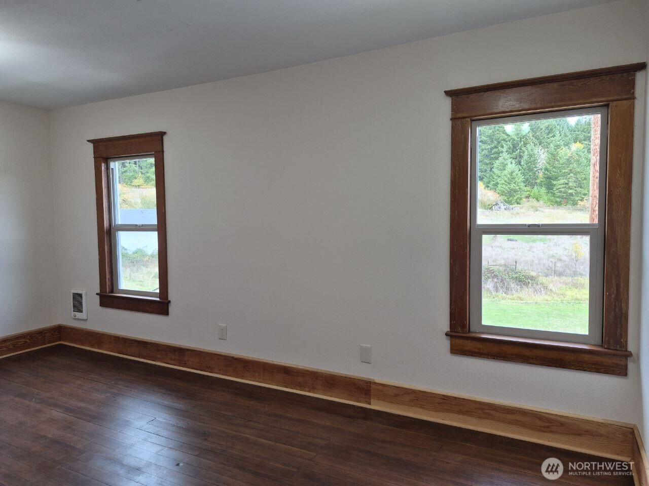 1604 Lincoln Creek Road Rochester, WA 98579 - Photo 28 of 37 an empty room with wooden floor and windows