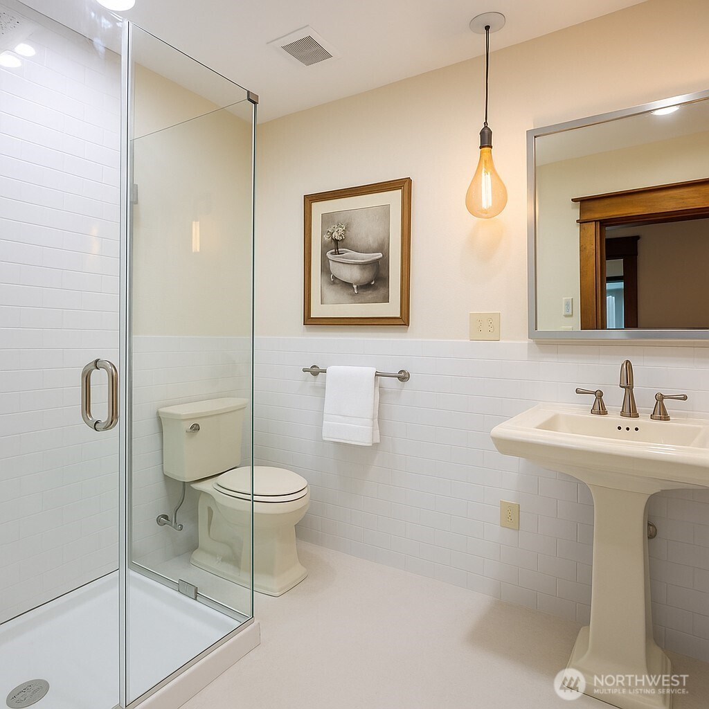 1604 Lincoln Creek Road Rochester, WA 98579 - Photo 29 of 37 a bathroom with a toilet a sink and mirror