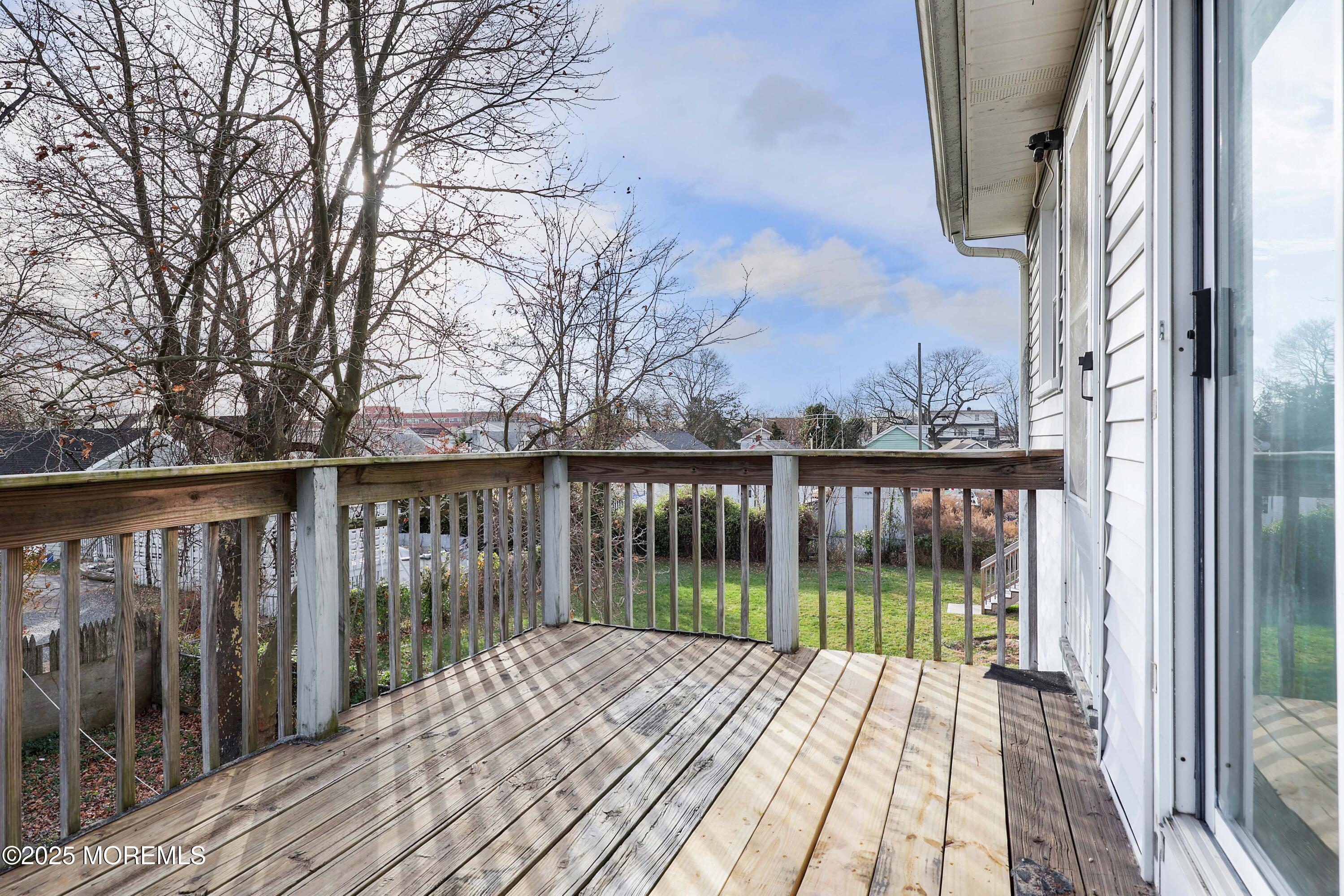 22 Commodore Avenue, Unit B UPPER Keansburg, NJ 07734 - Photo 14 of 20 a view of backyard with wooden deck and floor