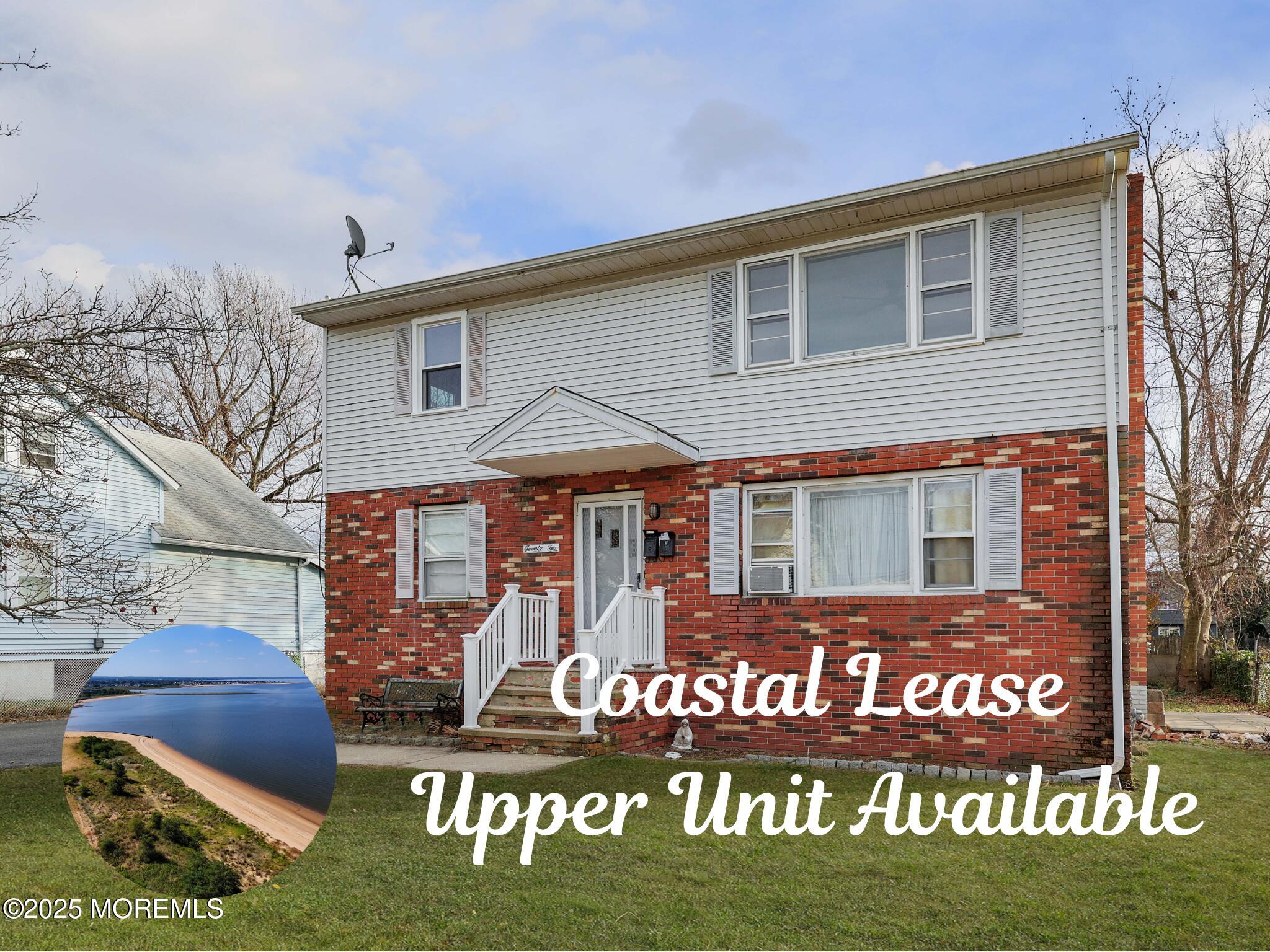 22 Commodore Avenue, Unit B UPPER Keansburg, NJ 07734 - Photo 18 of 20 a front view of multi story residential apartment building with yard