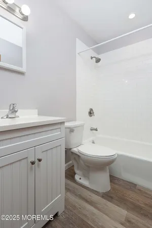 a bathroom with a toilet sink and shower