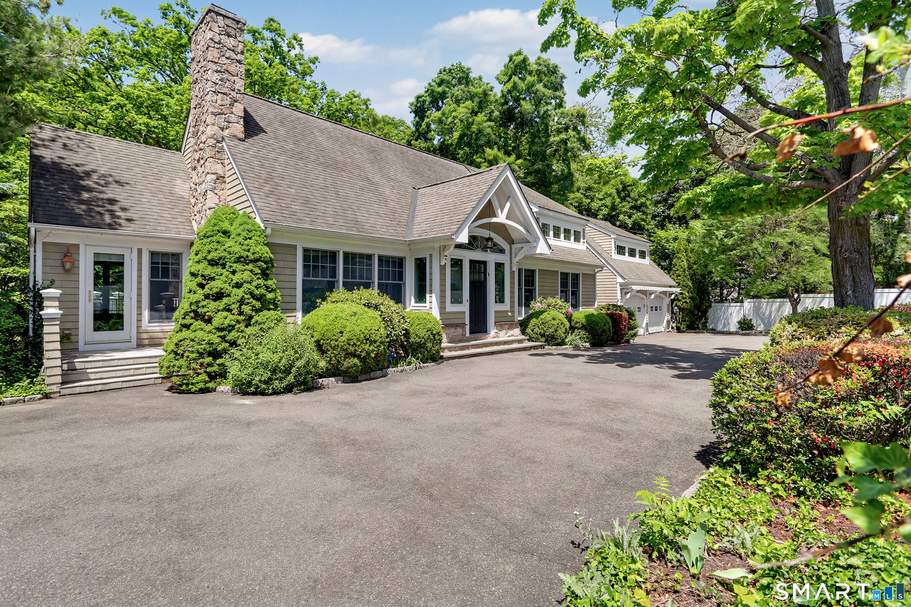 186 Compo Road South Westport, CT 06880 - Photo 36 of 40 Enter through the circular drive flanked by stone pillars with a tall privacy fence