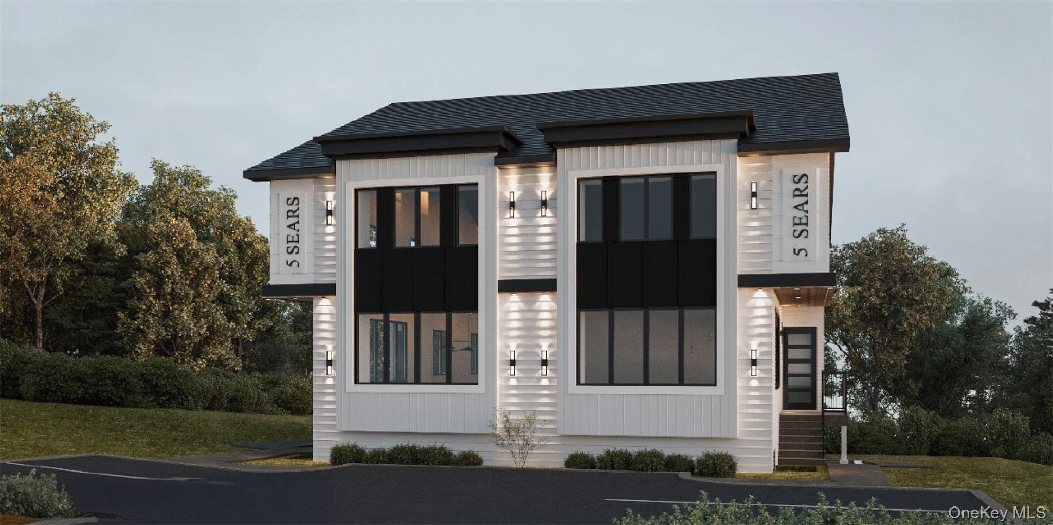 front view of a house with a small yard