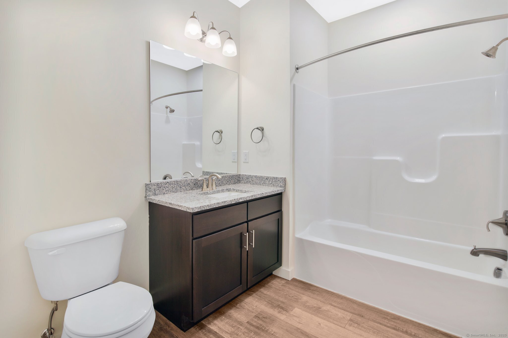 280 Salmon Brook Street, Unit 7107A Granby, CT 06035 - Photo 18 of 26 a bathroom with a sink a toilet and shower