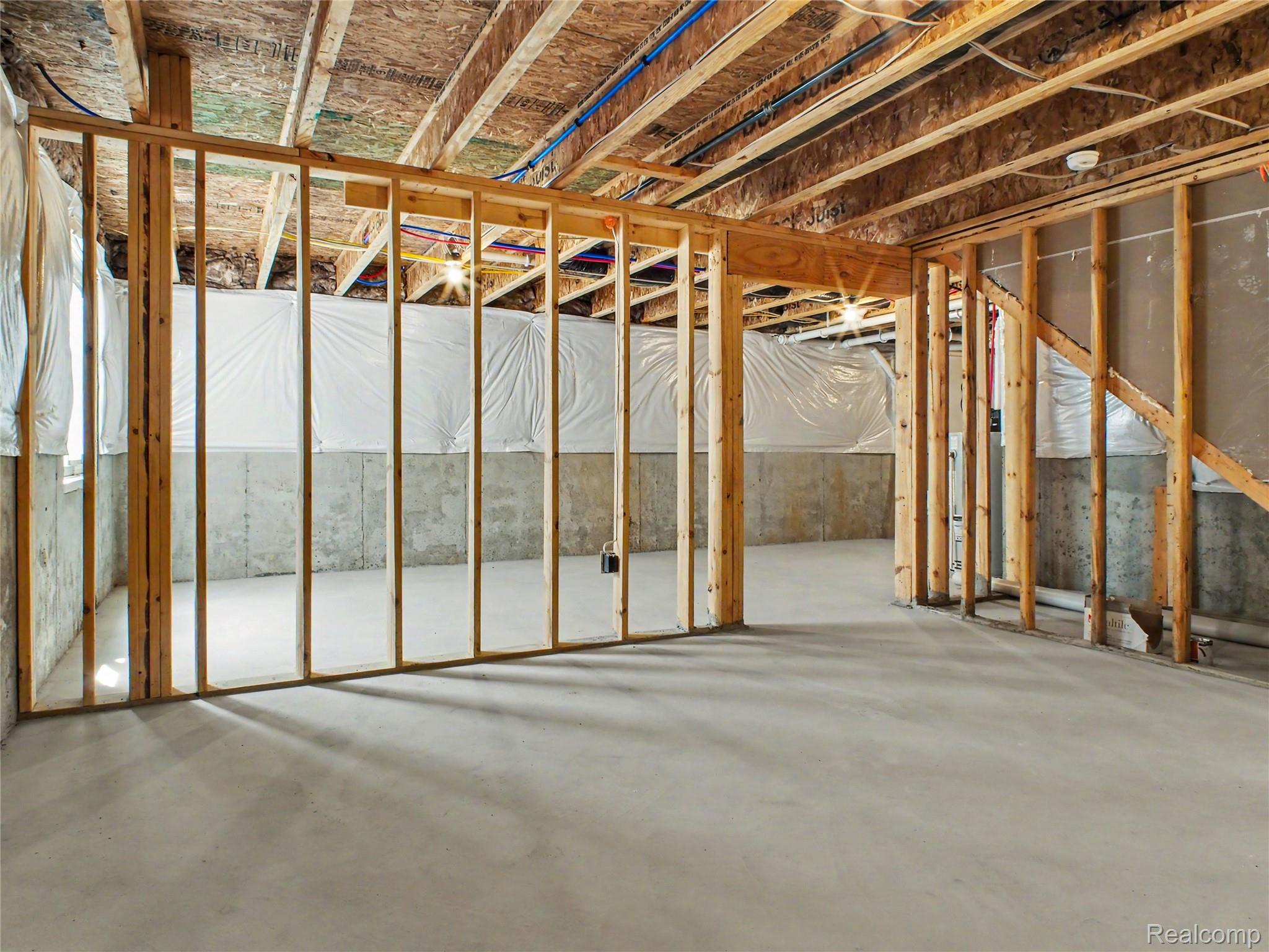 3185 Quail Ridge Court Clio, MI 48420 - Photo 16 of 35 The unfinished basement is a blank canvas for future completion and offers tons of storage.