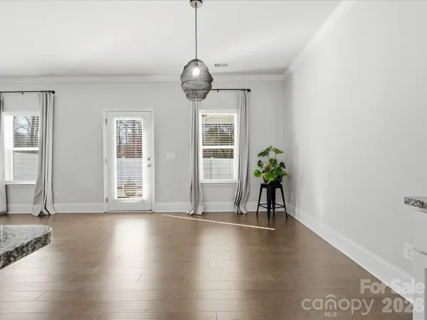 a view of livingroom with furniture wooden floor and windows