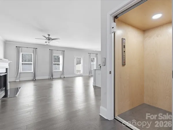 a view of a livingroom with wooden floor