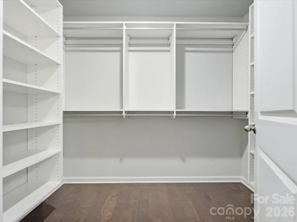 a close up view of an empty walk in closet