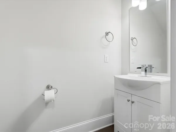 a bathroom with a sink and mirror