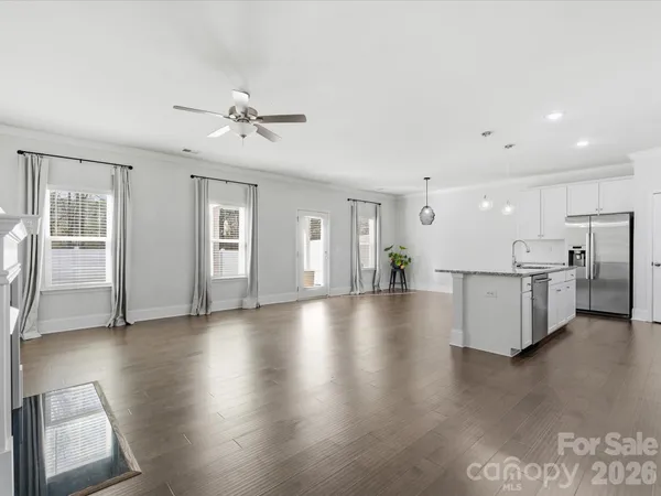 a view of a kitchen with a sink and a window