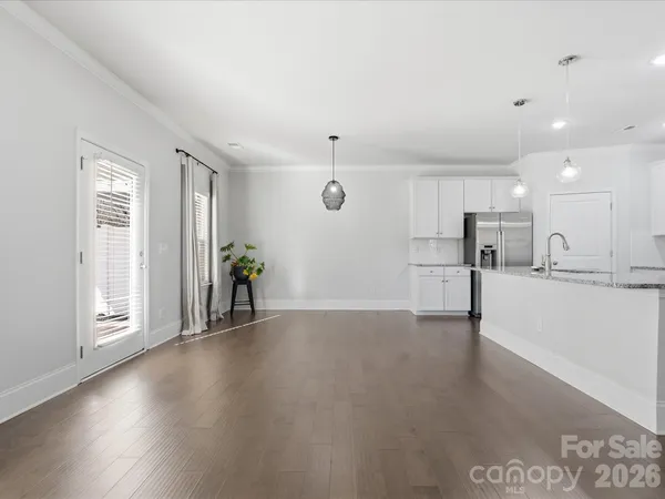 a view of a kitchen with a sink and cabinets