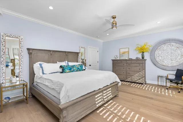 a spacious bedroom with a bed and a window