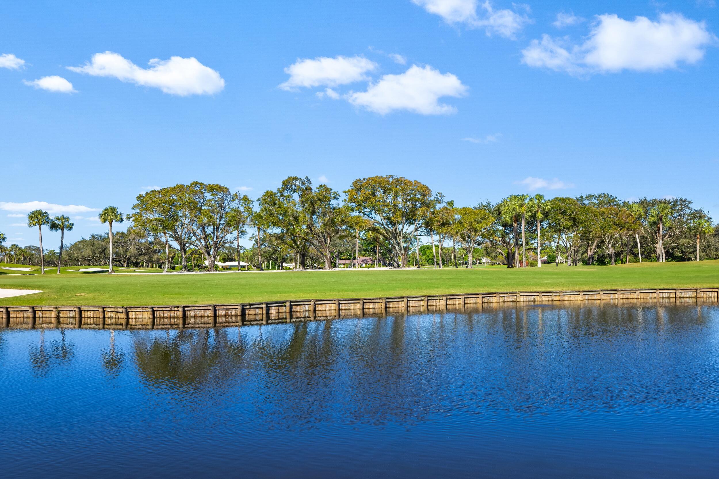 39 Country Road South Boynton Beach, FL 33436 - Photo 45 of 55 a view of a water pond with lots of green space and deers