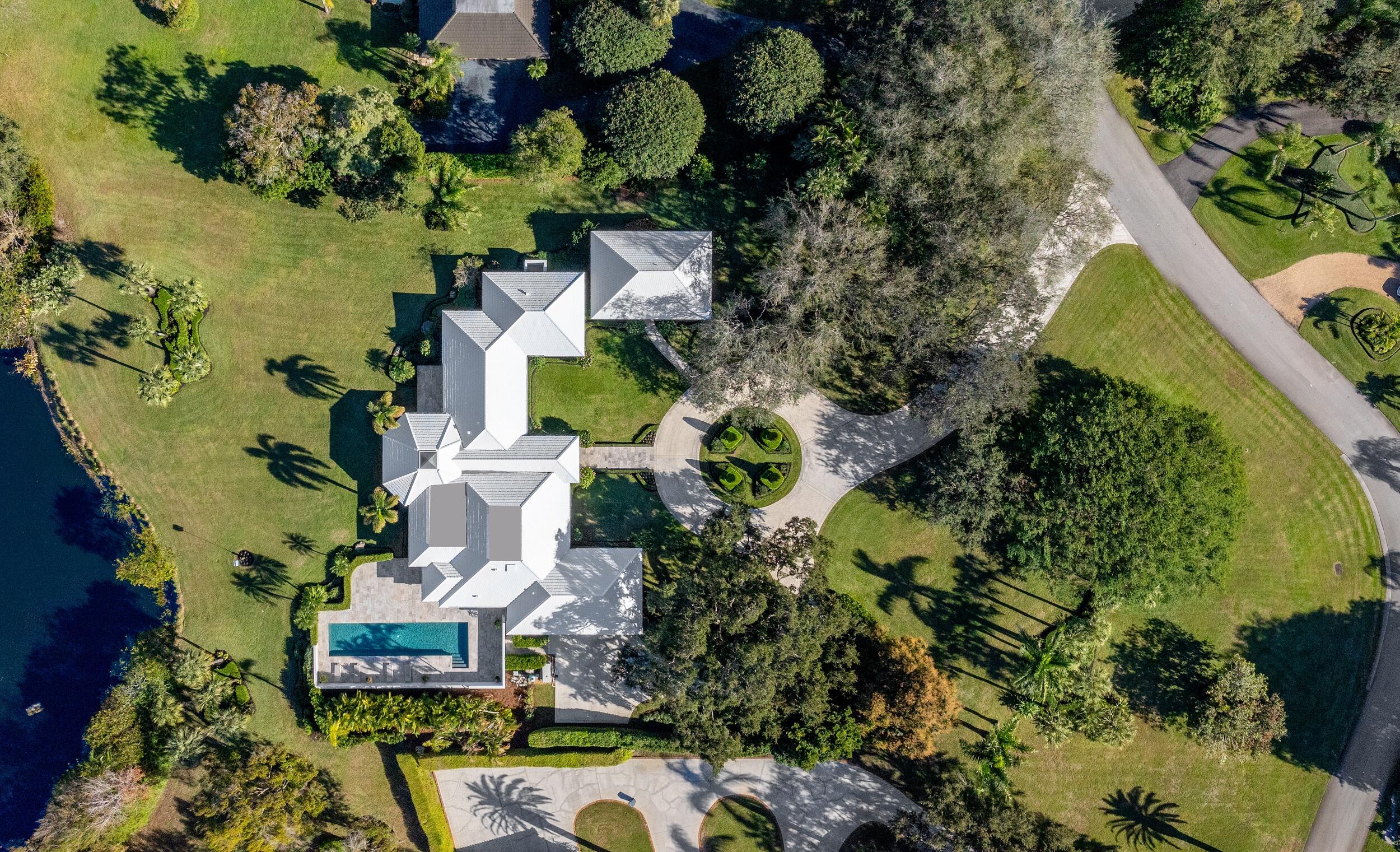 39 Country Road South Boynton Beach, FL 33436 - Photo 49 of 55 an aerial view of a house with a yard swimming pool and outdoor seating