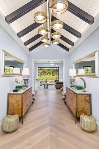 a room with fireplace furniture and a large window