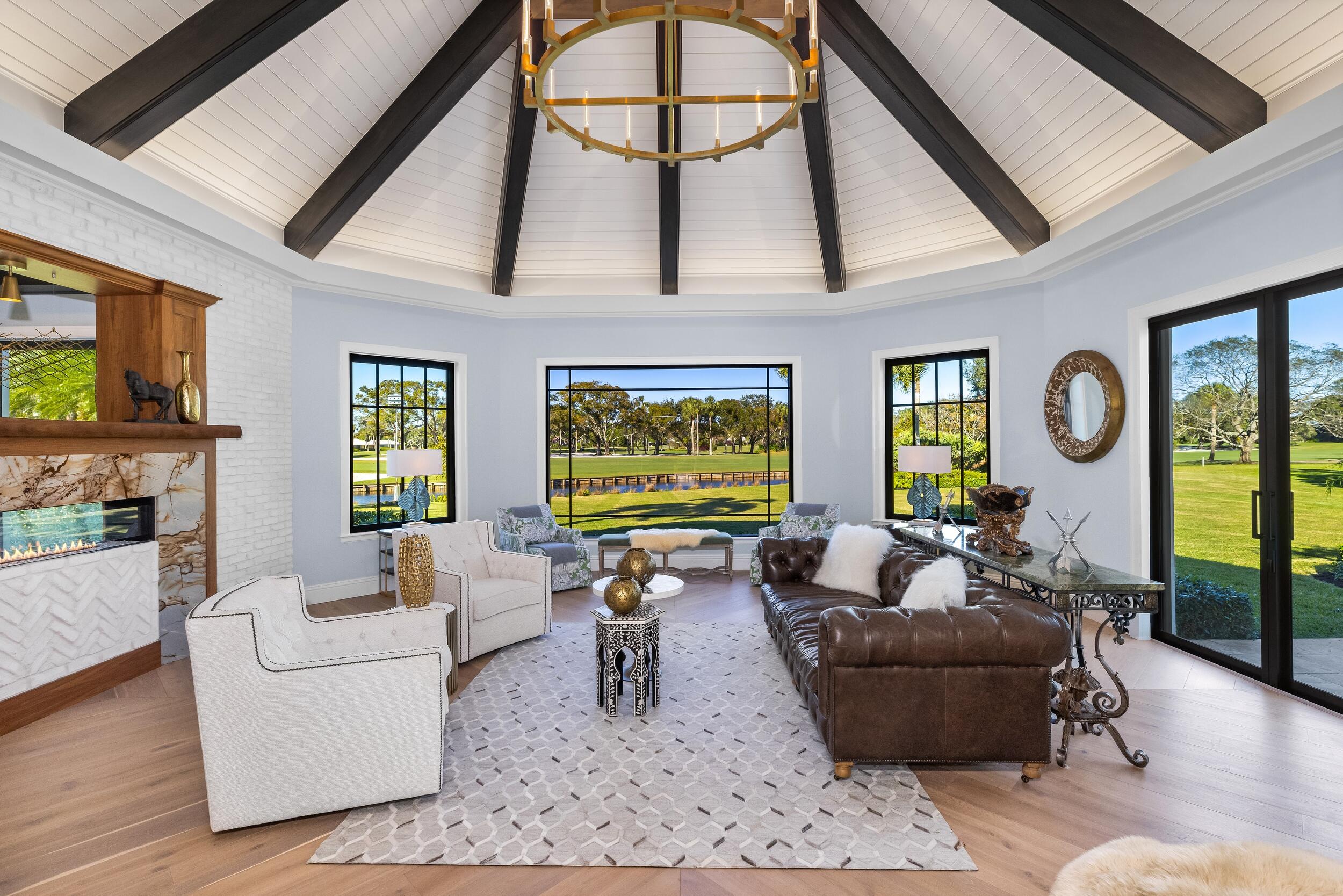 39 Country Road South Boynton Beach, FL 33436 - Photo 8 of 55 a living room with fireplace furniture and a flat screen tv