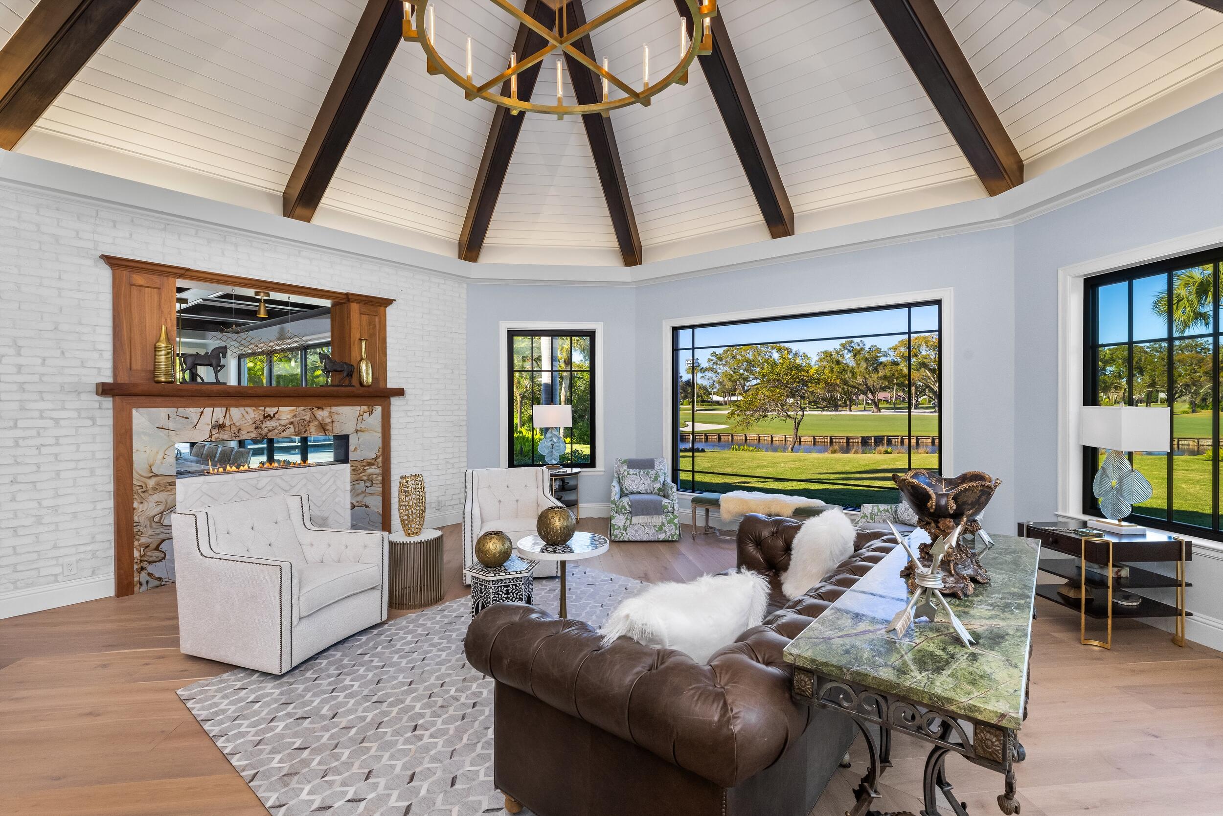 39 Country Road South Boynton Beach, FL 33436 - Photo 10 of 55 a living room with furniture and a flat screen tv