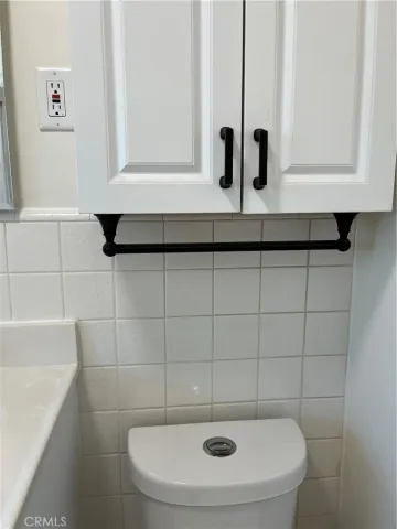 a bathroom with a sink toilet and vanity