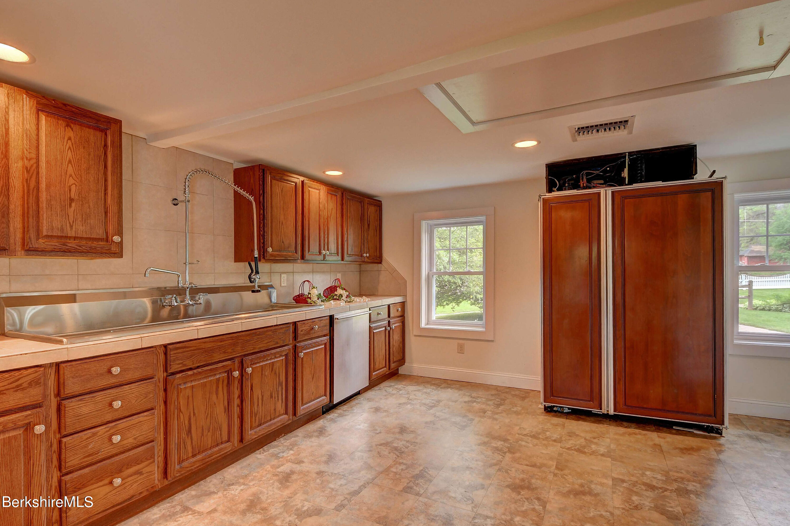 1 Devon Road Stockbridge, MA 01262 - Photo 54 of 58 a large bathroom with a granite countertop sink and a mirror