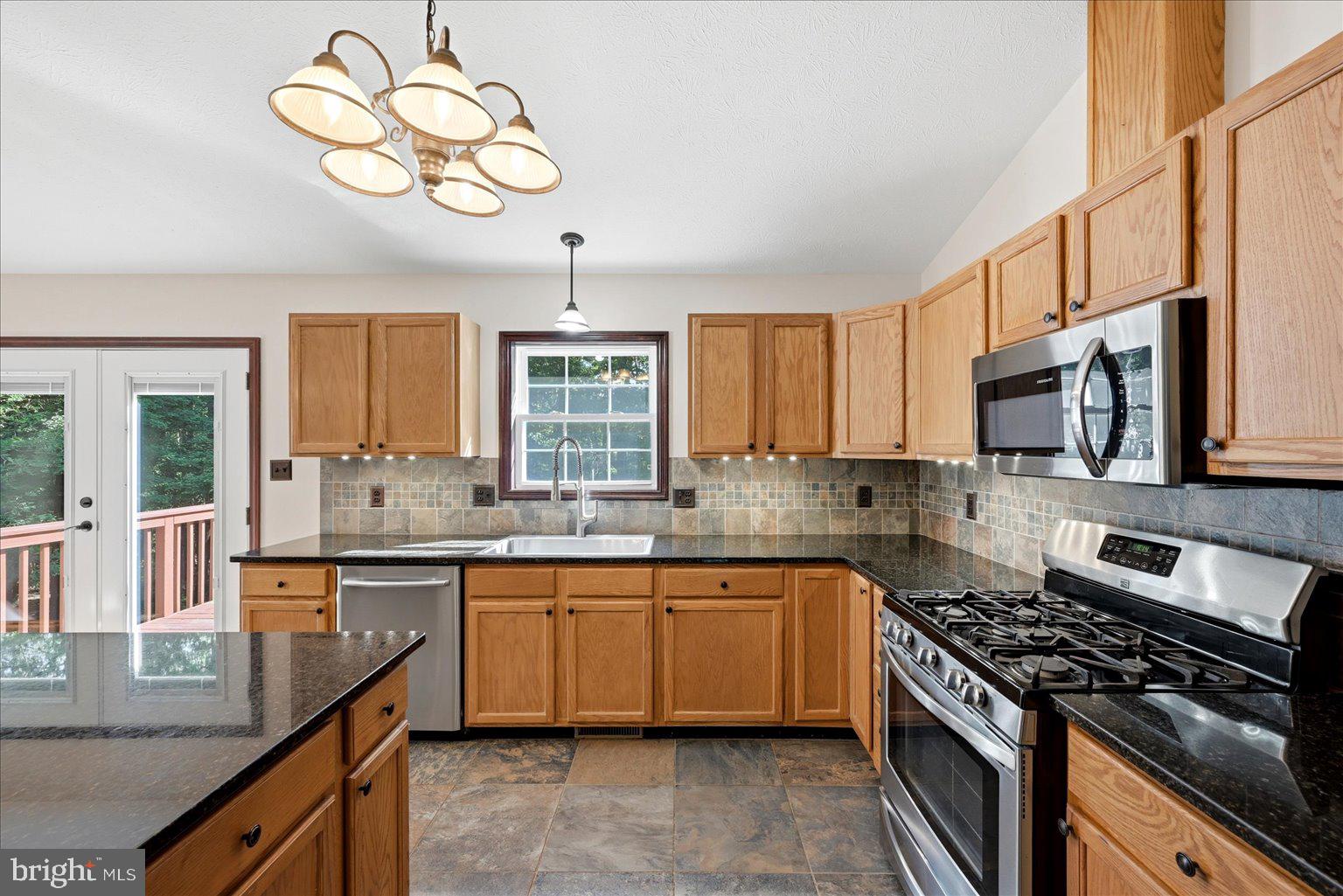 323 South Timber Ridge Road Cross Junction, VA 22625 - Photo 21 of 109 Modern kitchen with warm wood tones.