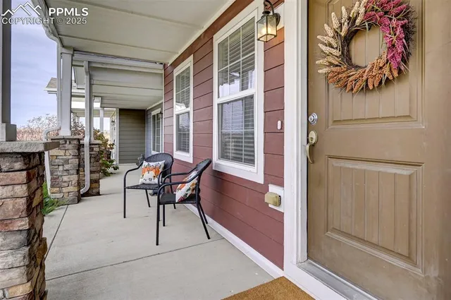 a patio with yard and outdoor seating