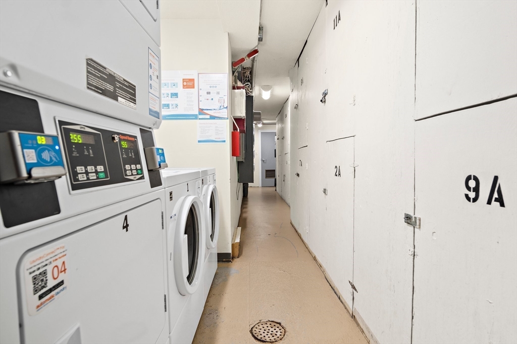 386 Great Road, Unit A8 Acton, MA 01720 - Photo 17 of 26 a utility room with dryer and washer