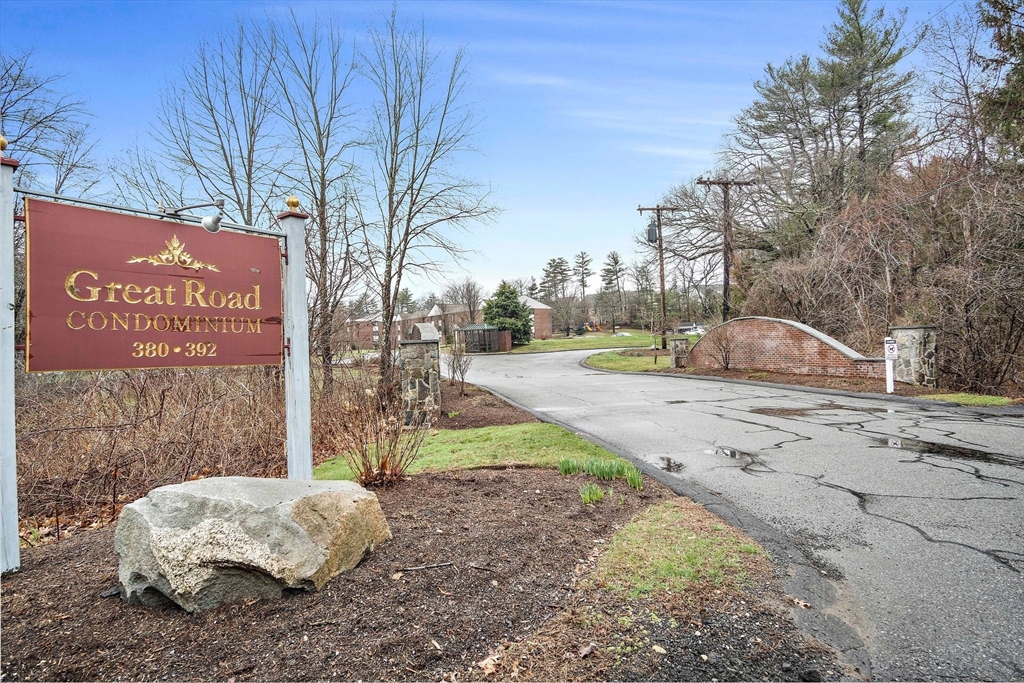 386 Great Road, Unit A8 Acton, MA 01720 - Photo 20 of 26 a sign that is sitting on the side of the road