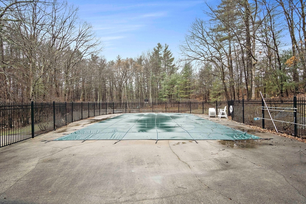 386 Great Road, Unit A8 Acton, MA 01720 - Photo 22 of 26 a backyard of a house with trees