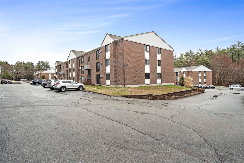 386 Great Road, Unit A8 Acton, MA 01720 - Photo 26 of 26 a car parked on the side of the road