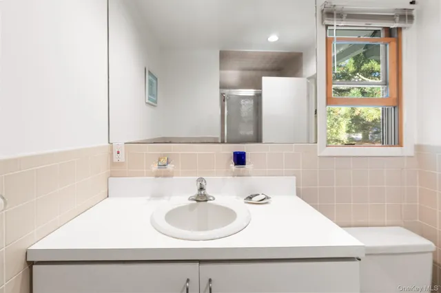 a bed room with a bed and a night stand