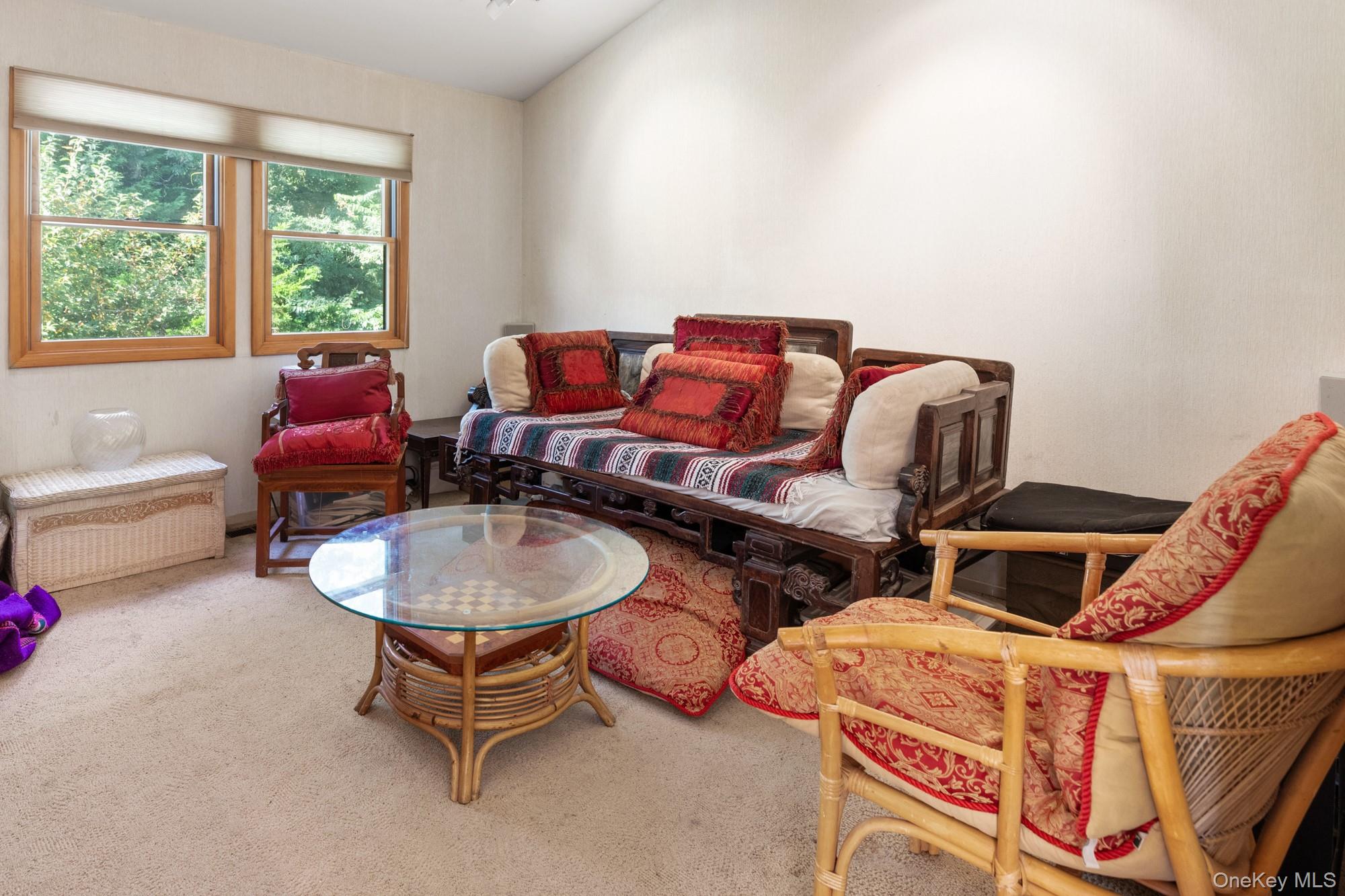 29 Kenwood Road Southampton, NY 11968 - Photo 18 of 35 a living room with furniture a air conditioner and a window