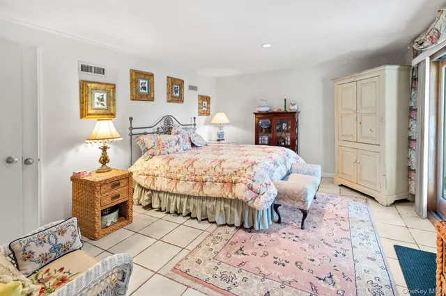 a living room with furniture and a large window with outer view