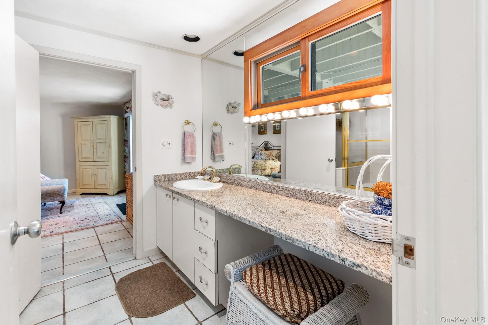 29 Kenwood Road Southampton, NY 11968 - Photo 24 of 35 a kitchen with a sink and a refrigerator