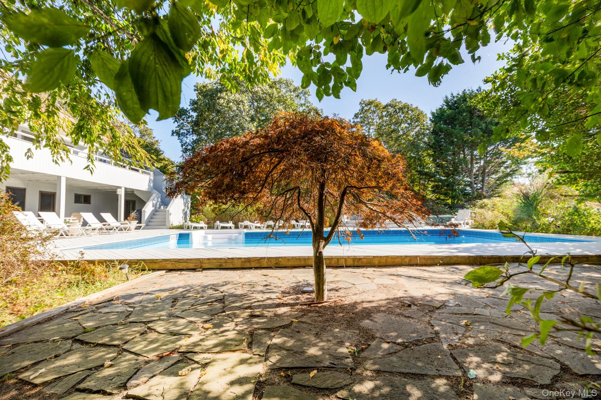 29 Kenwood Road Southampton, NY 11968 - Photo 27 of 35 a view of a house with swimming pool and sitting area