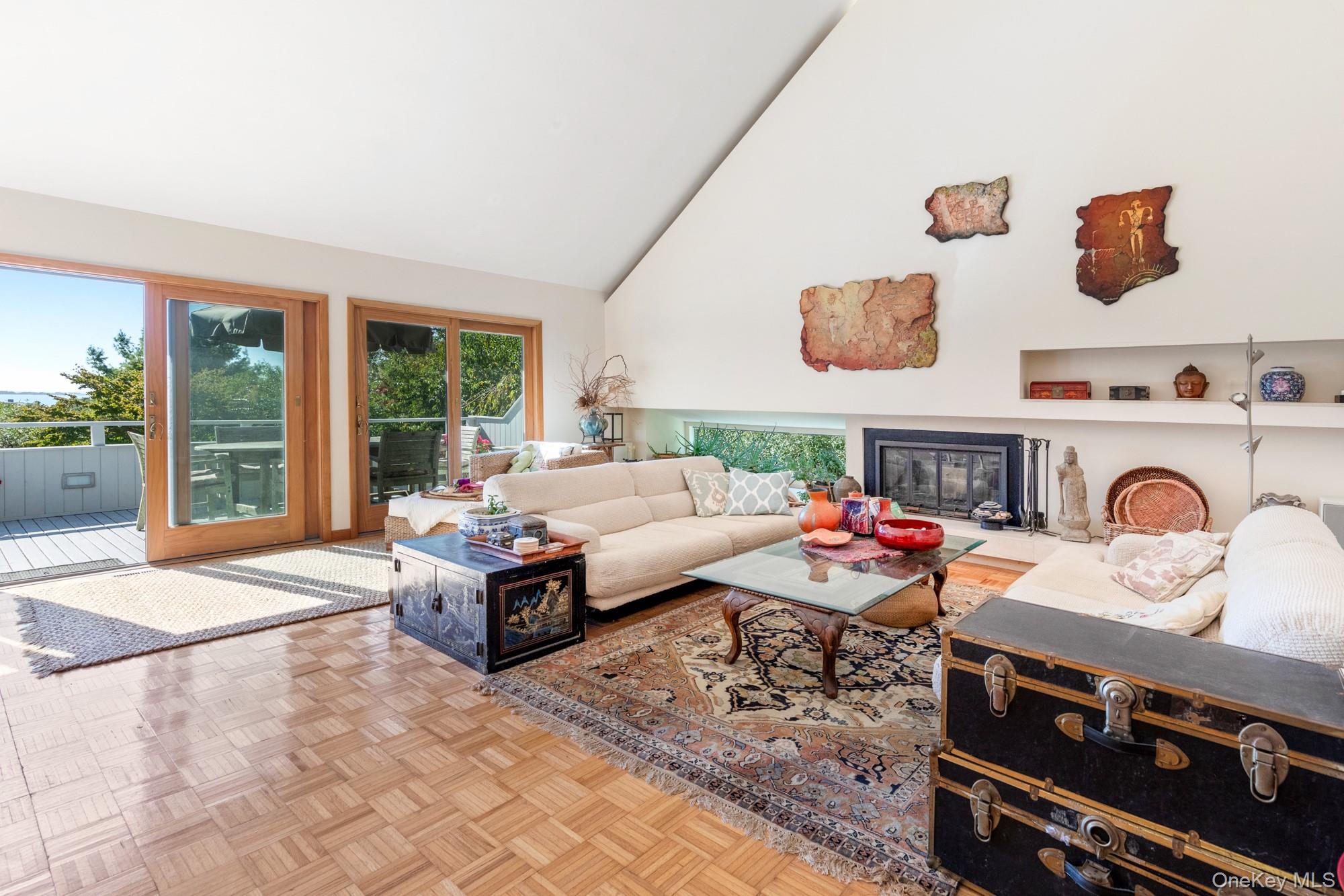29 Kenwood Road Southampton, NY 11968 - Photo 7 of 35 a living room with furniture and a floor to ceiling window