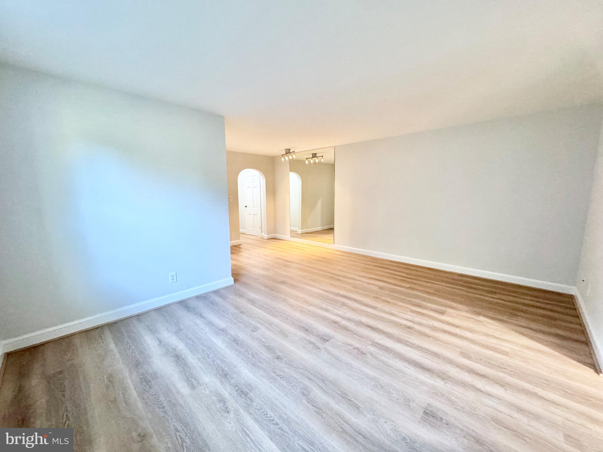 22 South Old Glebe Road, Unit 106D Arlington, VA 22204 - Photo 12 of 19 Spacious, sunlit living area awaits your touch.