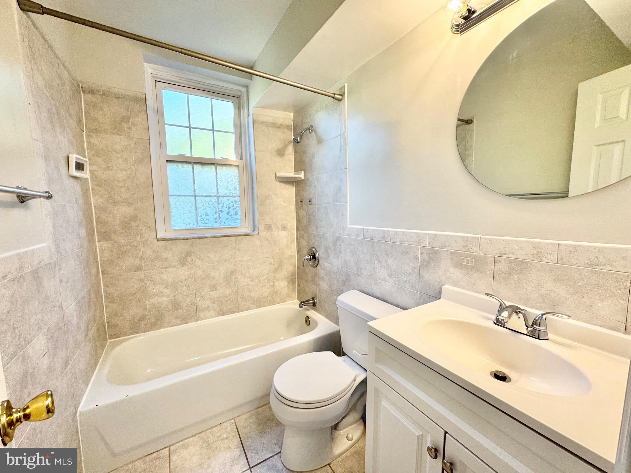 22 South Old Glebe Road, Unit 106D Arlington, VA 22204 - Photo 13 of 19 Bright and airy bathroom with modern finishes.