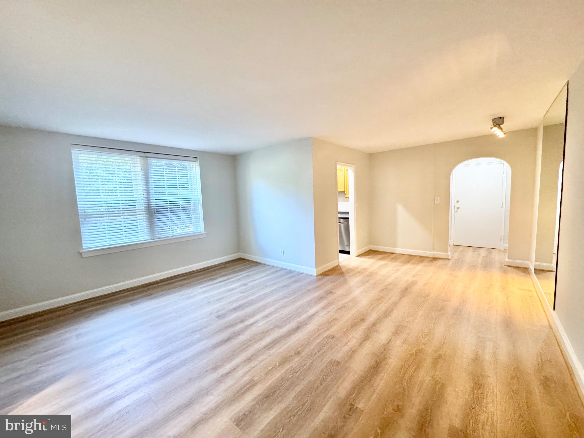 22 South Old Glebe Road, Unit 106D Arlington, VA 22204 - Photo 10 of 19 Bright and airy open living space.