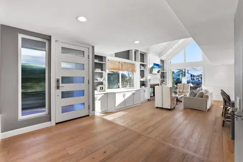 a bathroom with a double vanity sink mirror and toilet