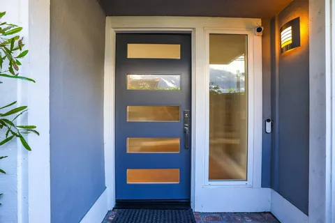a bedroom with a bed and a television