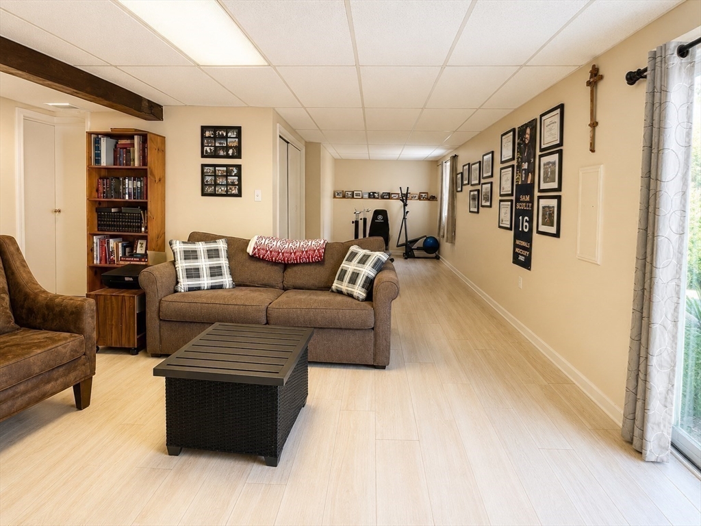 38 Crescent Road, Unit 38 Needham, MA 02494 - Photo 12 of 23 a living room with furniture and a wall painting
