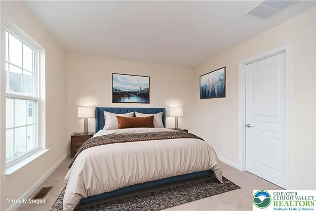 a bedroom with bed and a window