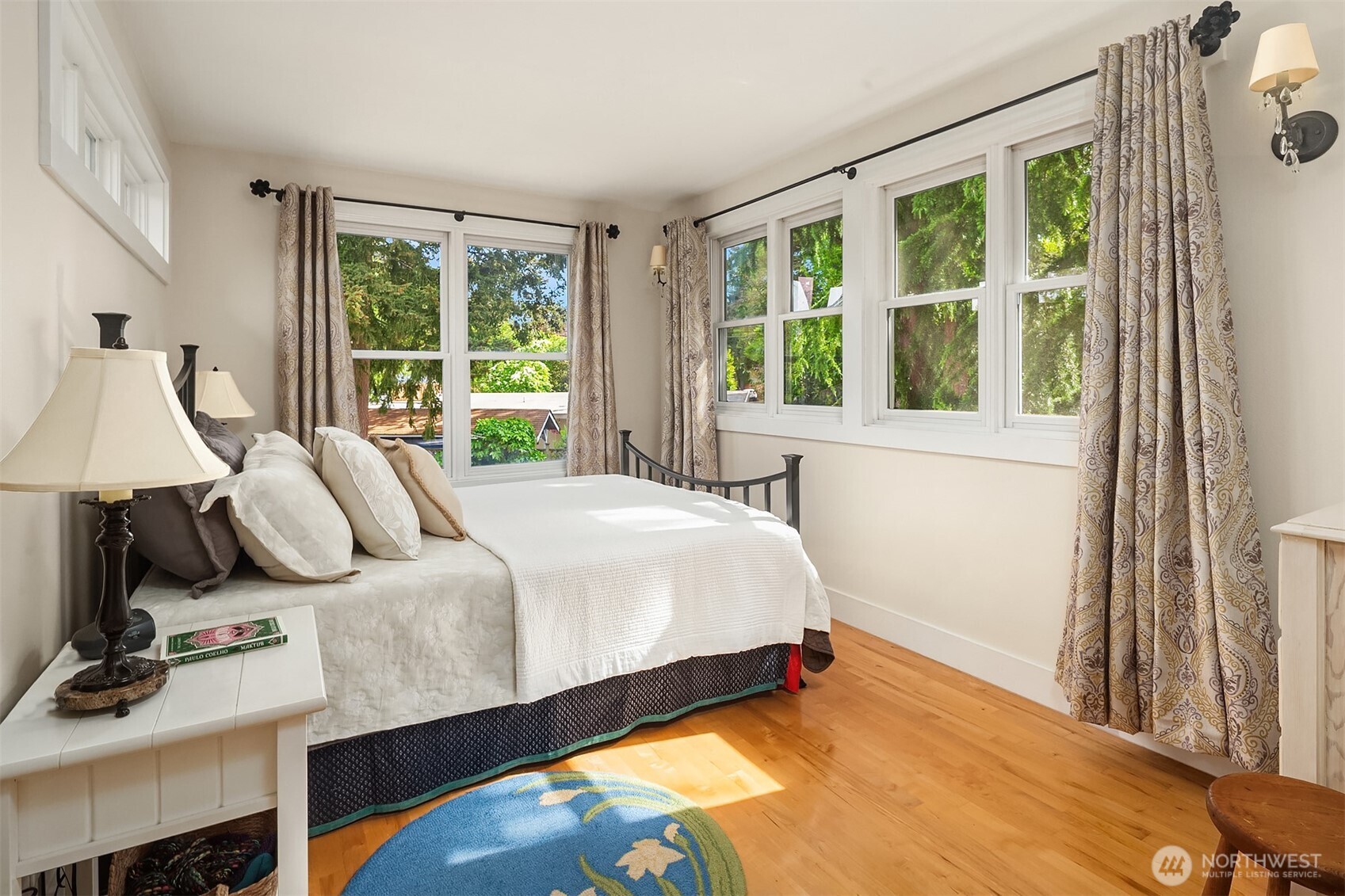 7732 195th Street Southwest Edmonds, WA 98026 - Photo 20 of 39 a bed sitting in a bedroom next to a window