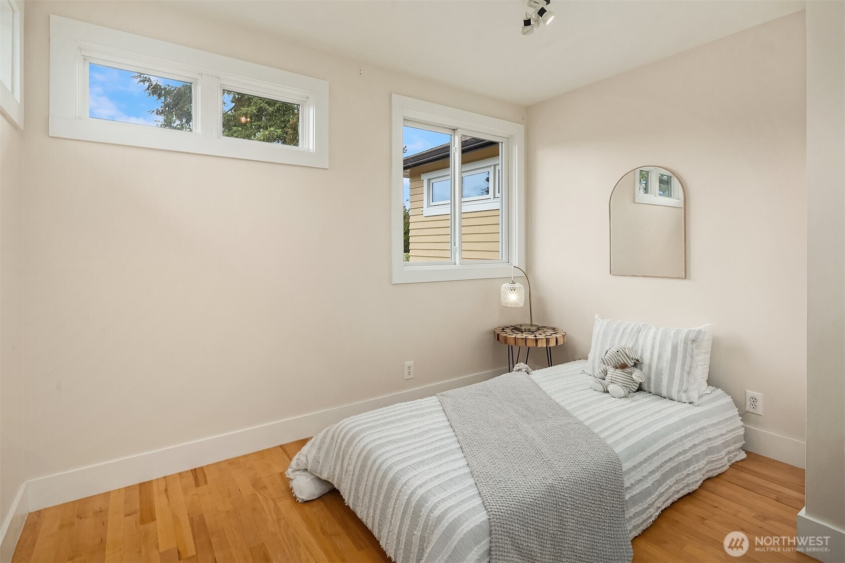 7732 195th Street Southwest Edmonds, WA 98026 - Photo 24 of 39 a bedroom with a bed and a painting on the wall
