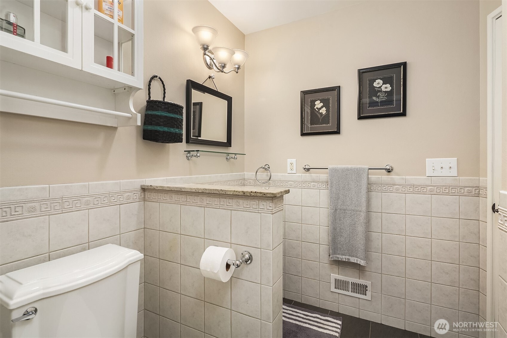7732 195th Street Southwest Edmonds, WA 98026 - Photo 25 of 39 a bathroom with a granite countertop toilet sink and mirror