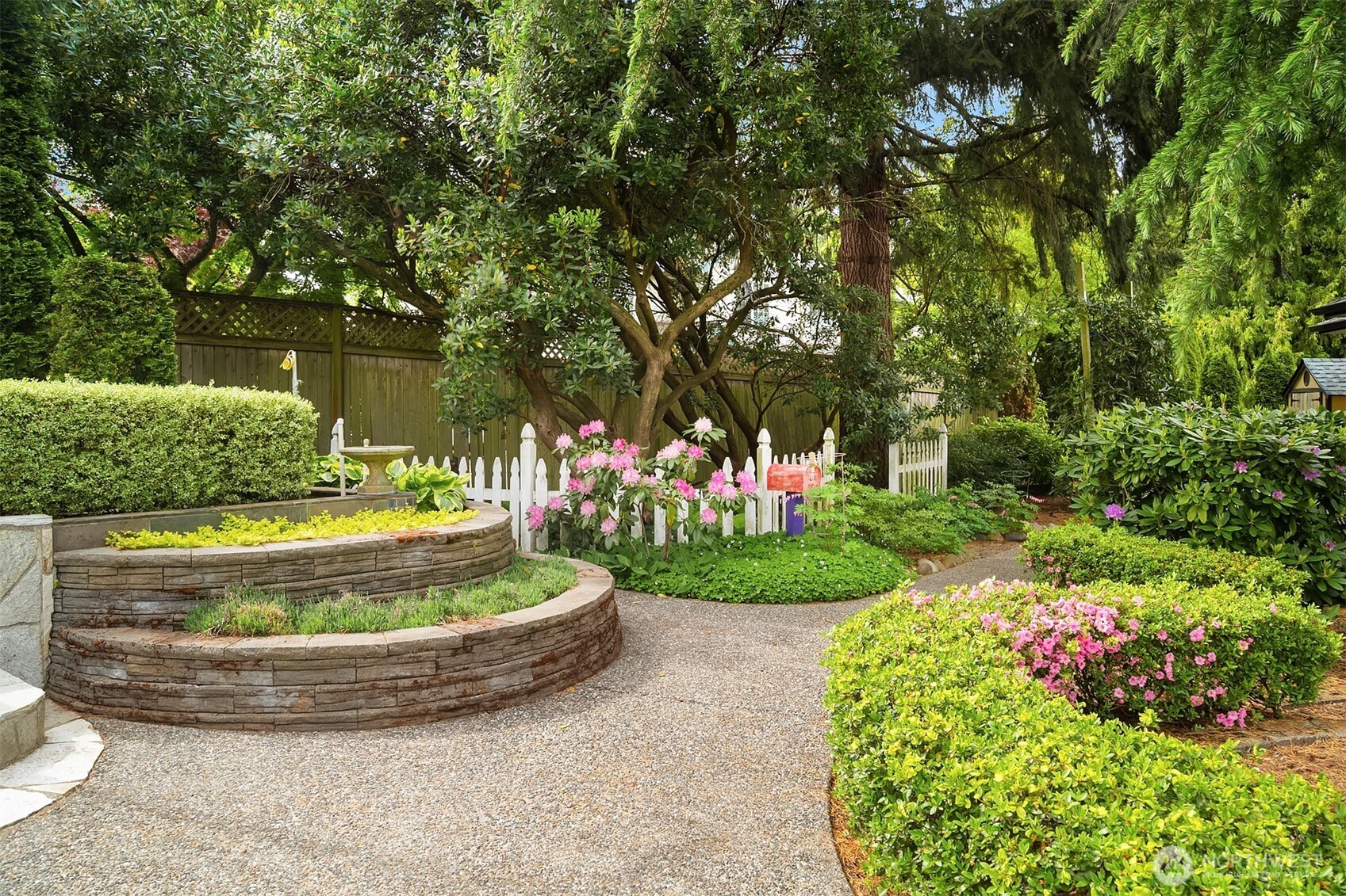 7732 195th Street Southwest Edmonds, WA 98026 - Photo 28 of 39 a view of a garden with a fountain