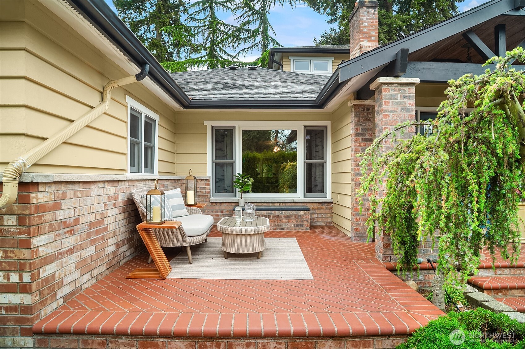 7732 195th Street Southwest Edmonds, WA 98026 - Photo 35 of 39 a view of a patio with table and chairs and potted plants